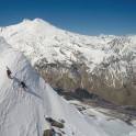 Russia, Caucasus, Elbrus region. Mt.Cheget. Riders Igor Ilynikh and Konstantin Galat climb to start-point. Photo by Oleg Kolmovskiy (drone)