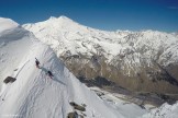 Russia, Caucasus, Elbrus region. Mt.Cheget. Riders Igor Ilynikh and Konstantin Galat climb to start-point. Photo by Oleg Kolmovskiy (drone)